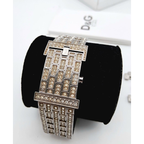 203 - An absolutely stanning, DOLCE & GABBANA TIME ladies bracelet watch, totally covered with “diamanté”,... 