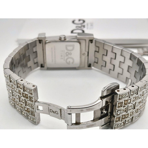 203 - An absolutely stanning, DOLCE & GABBANA TIME ladies bracelet watch, totally covered with “diamanté”,... 