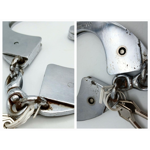 210 - A vintage HIATTS 1960 handcuffs with two keys, the preferred “bracelets” of security forces all over... 