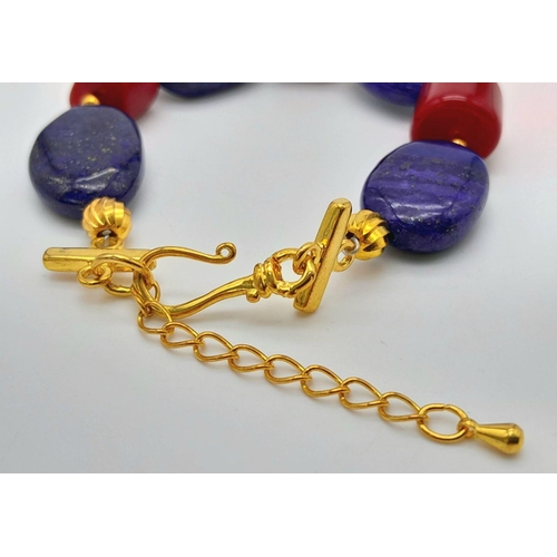 224 - A substantial and very attractive necklace, bracelet and earring set with large oval shaped lapis la... 