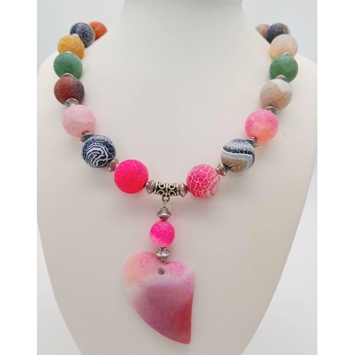 231 - A fascinating, multicoloured, crackled agate necklace and earrings set with a large heart shaped pen... 