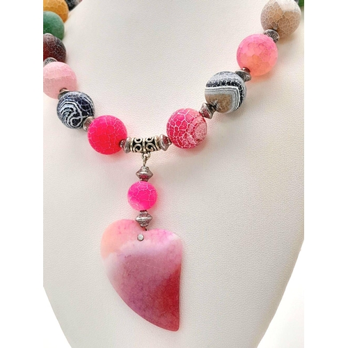 231 - A fascinating, multicoloured, crackled agate necklace and earrings set with a large heart shaped pen... 