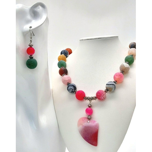 231 - A fascinating, multicoloured, crackled agate necklace and earrings set with a large heart shaped pen... 