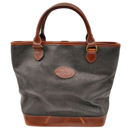 249 - A Vintage Mulberry Small Tote Bag. Black textured leather exterior with burgundy leather accents and... 