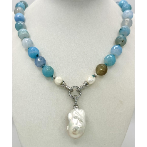 296 - A Wonderful Blue Striped Agate Necklace with Hanging Baroque Pearl Pendant. 12mm beads. 5cm hanging ... 