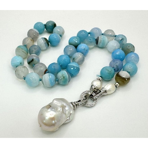 296 - A Wonderful Blue Striped Agate Necklace with Hanging Baroque Pearl Pendant. 12mm beads. 5cm hanging ... 