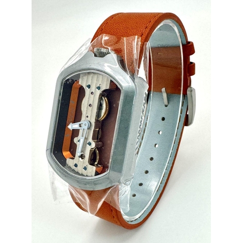 298 - A Verticale Mechanical Top Winder Gents Watch. Brown leather strap. Ceramic silver tone skeleton cas... 