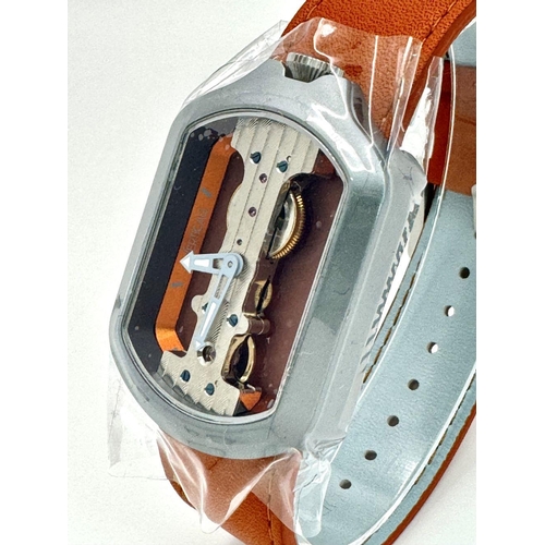 298 - A Verticale Mechanical Top Winder Gents Watch. Brown leather strap. Ceramic silver tone skeleton cas... 