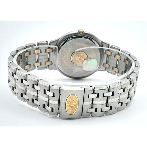 312 - A Romanson Eleve, Bi-Metal and Diamond Quartz Gents Watch. Bi-metal (18k gold and steel) bracelet an... 