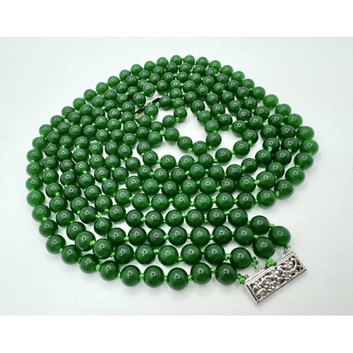 338 - A Classic Four-Row Chinese Dark Green Jade Bead Necklace. 8mm beads. 42-46cm necklace length.