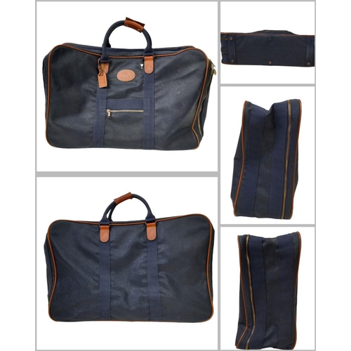 442 - Two Extra-Large Mulberry 'Weekend' Travel Bags. Textured blue leather exterior with brown leather pi... 