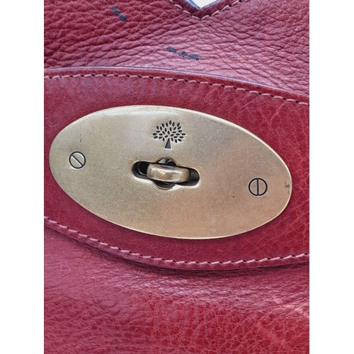 449 - A Vintage Mulberry Dark Red Leather Handbag. Textured red leather exterior with clip open compartmen... 