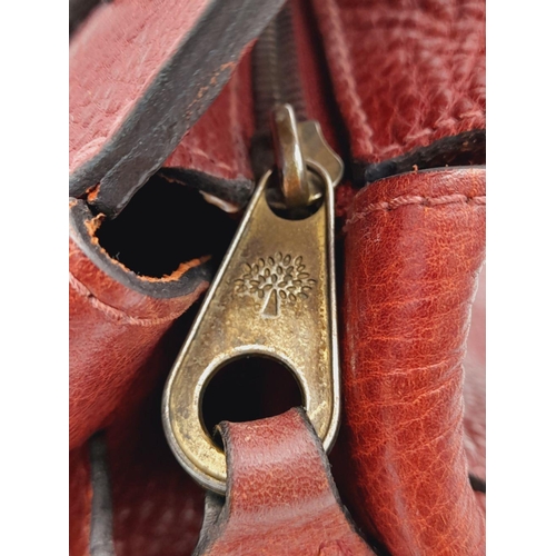 449 - A Vintage Mulberry Dark Red Leather Handbag. Textured red leather exterior with clip open compartmen... 