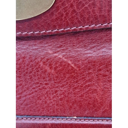 449 - A Vintage Mulberry Dark Red Leather Handbag. Textured red leather exterior with clip open compartmen... 