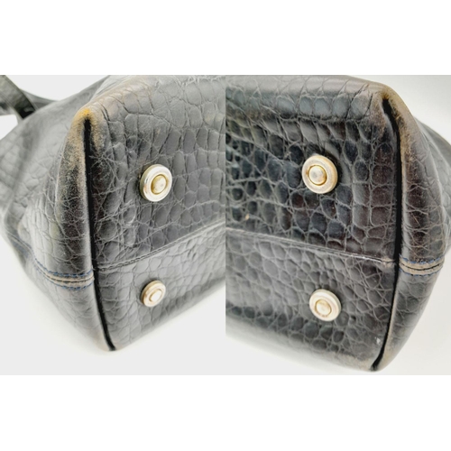 456 - A Vintage Mulberry Black Snake-Effect Leather Shoulder Bag. 
Tartan textile interior. 26cm x 27cm. P... 