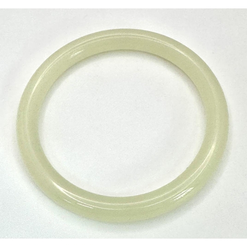 480 - A Classic Thin Pale-Green Jade Chinese Bangle. 8mm width. 60mm inner diameter.