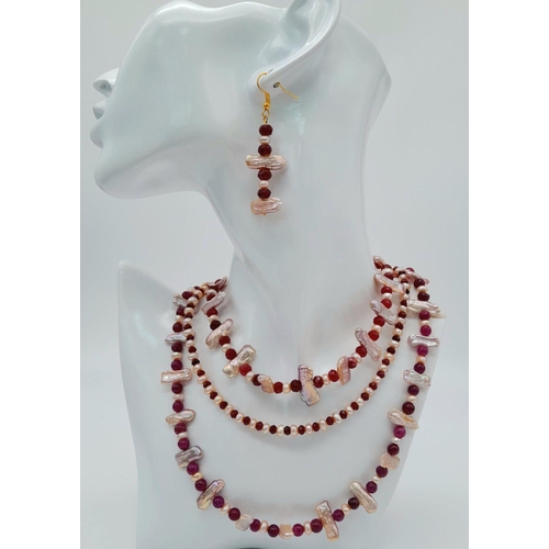 119 - A magnificent three string necklace with long (Biwa) and round pink cultured pearls and round rubies... 