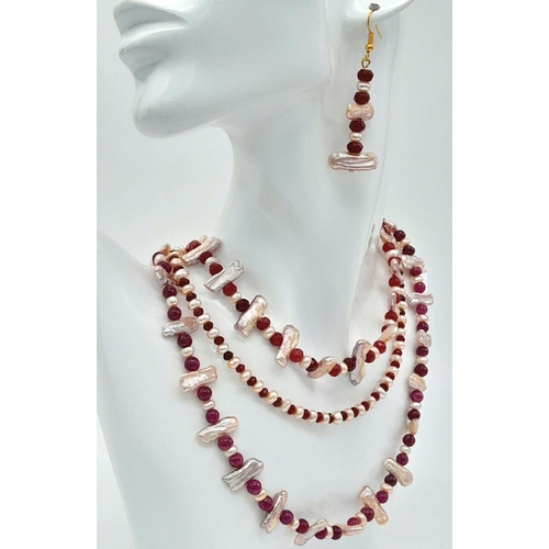 119 - A magnificent three string necklace with long (Biwa) and round pink cultured pearls and round rubies... 