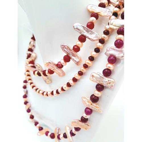 119 - A magnificent three string necklace with long (Biwa) and round pink cultured pearls and round rubies... 