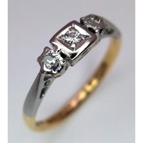 130 - AN 18K YELLOW GOLD & PLATINUM VINTAGE DIAMOND THREE STONE RING. 2.45G IN WEIGHT. SIZE N AND 1/2. Ref... 