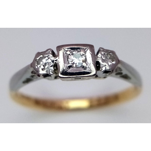 130 - AN 18K YELLOW GOLD & PLATINUM VINTAGE DIAMOND THREE STONE RING. 2.45G IN WEIGHT. SIZE N AND 1/2. Ref... 