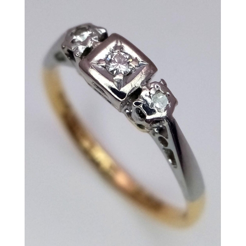 130 - AN 18K YELLOW GOLD & PLATINUM VINTAGE DIAMOND THREE STONE RING. 2.45G IN WEIGHT. SIZE N AND 1/2. Ref... 