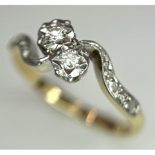 369 - 18K YELLOW GOLD 2 DIAMOND CROSSOVER RING. 2.37G IN WEIGHT. SIZE M.
Ref: SC 6052.