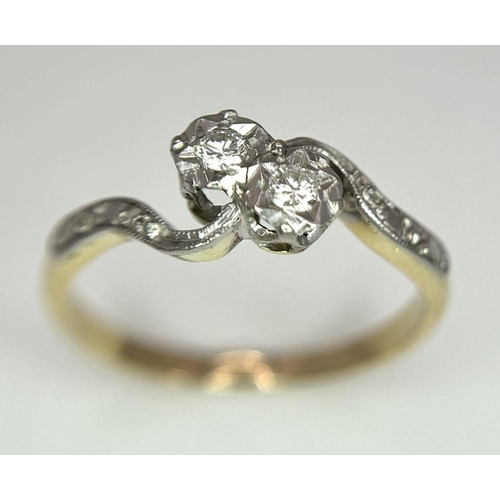 369 - 18K YELLOW GOLD 2 DIAMOND CROSSOVER RING. 2.37G IN WEIGHT. SIZE M.
Ref: SC 6052.