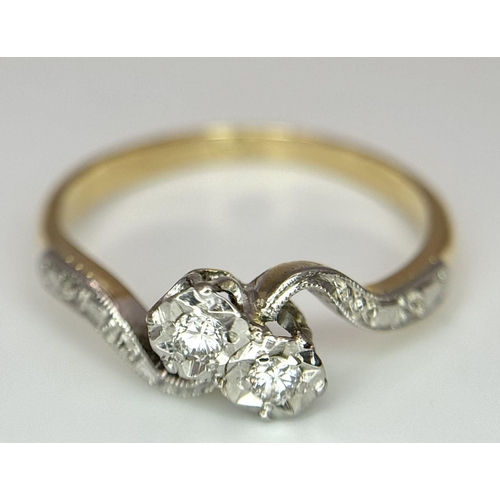 369 - 18K YELLOW GOLD 2 DIAMOND CROSSOVER RING. 2.37G IN WEIGHT. SIZE M.
Ref: SC 6052.