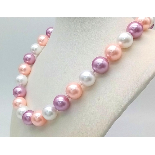 1492 - A Delightful Pastel Coloured South Sea Pearl Shell Necklace.
14mm beads. 44cm necklace length.