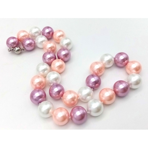 1492 - A Delightful Pastel Coloured South Sea Pearl Shell Necklace.
14mm beads. 44cm necklace length.