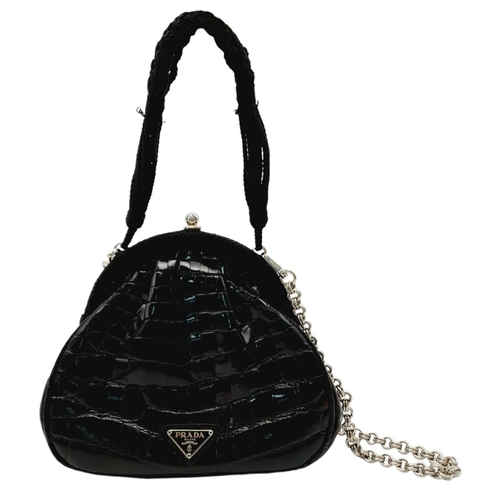 192 - A Prada Black Coccodrillo Evening Bag. Crocodile leather exterior with silver-toned hardware, textil... 