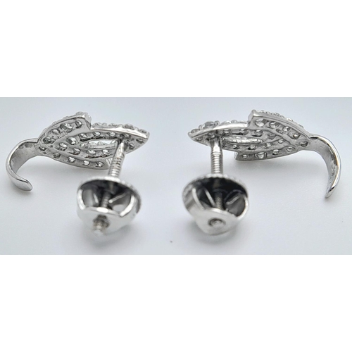 144 - A PAIR OF 18K WHITE GOLD ( TESTED ) DIAMOND SET EARRINGS WITH SCREW BACK FITTINGS 2.2G TOTAL WEIGHT.... 