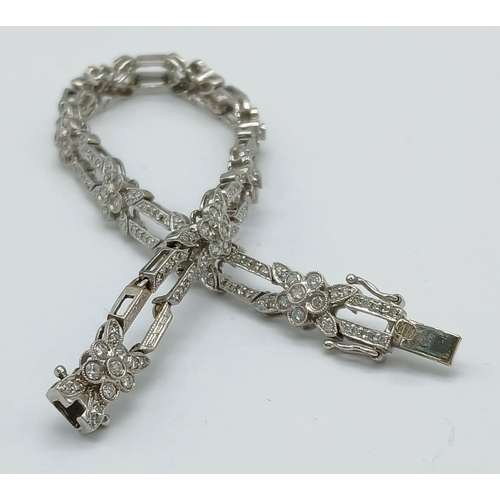 151 - A 14K WHITE GOLD DIAMOND SET BRACELET 1.50CT, 13G TOTAL WEIGHT, 19CM LENGTH.

ref: SC 6065