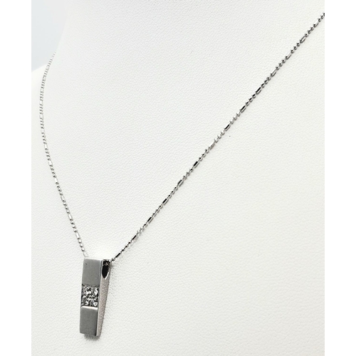 193 - A 18K WHITE GOLD DIAMOND SET PENDANT ON 16