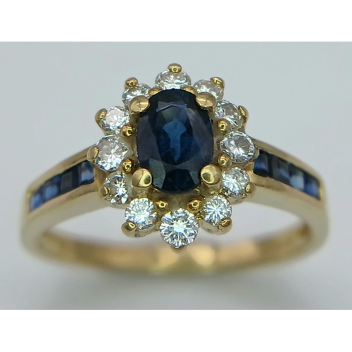 214 - A 18K YELLOW GOLD DIAMOND & SAPPHIRE CLUSTER RING. TOTAL WEIGHT 3.4G. SIZE K. REF PERS 6001