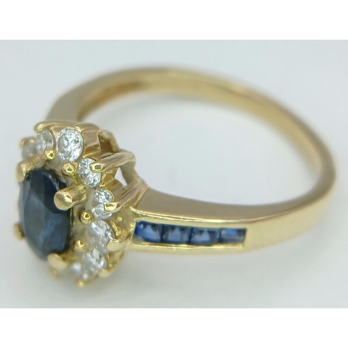 214 - A 18K YELLOW GOLD DIAMOND & SAPPHIRE CLUSTER RING. TOTAL WEIGHT 3.4G. SIZE K. REF PERS 6001