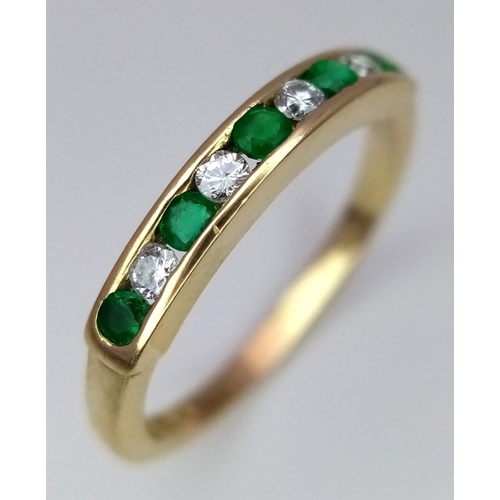 235 - A 18K YELLOW GOLD DIAMOND & EMERALD 1/2 ETERNITY RING. TOTAL WEIGHT 2.4G. SIZE L. REF SPAS 6002.