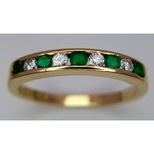 235 - A 18K YELLOW GOLD DIAMOND & EMERALD 1/2 ETERNITY RING. TOTAL WEIGHT 2.4G. SIZE L. REF SPAS 6002.