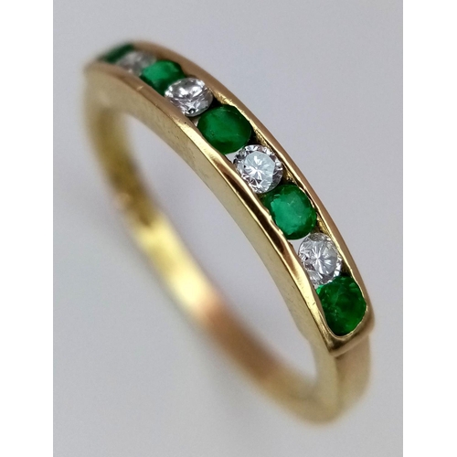 235 - A 18K YELLOW GOLD DIAMOND & EMERALD 1/2 ETERNITY RING. TOTAL WEIGHT 2.4G. SIZE L. REF SPAS 6002.