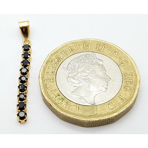 240 - A 9K YELLOW GOLD ARTICULATED SAPPHIRE SET DROP PENDANT. 0.3G IN WEIGHT. Ref: SC 5016.