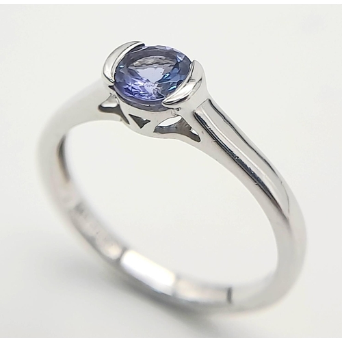 444 - A 10 Carat White Gold Tanzanite Solitaire Ring Size L1/2. Set with a 5mm Round Cut Quality Tanzanite... 