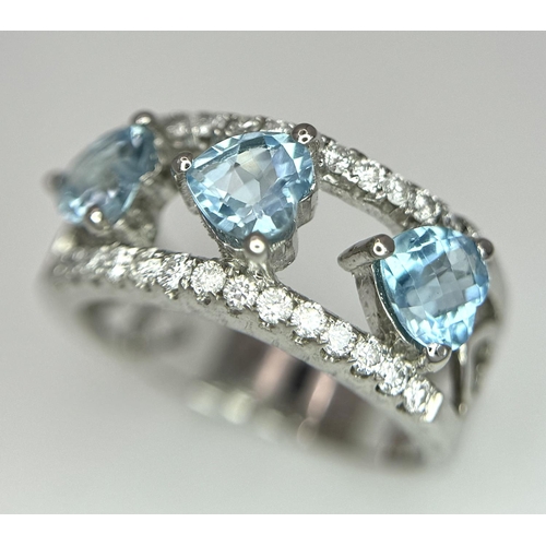 523 - A 18K WHITE GOLD 0.38CT DIAMOND & BLUE TOPAZ RING. TOTAL WEIGHT 5G. SIZE M. REF AS 1077.