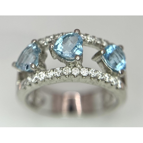 523 - A 18K WHITE GOLD 0.38CT DIAMOND & BLUE TOPAZ RING. TOTAL WEIGHT 5G. SIZE M. REF AS 1077.