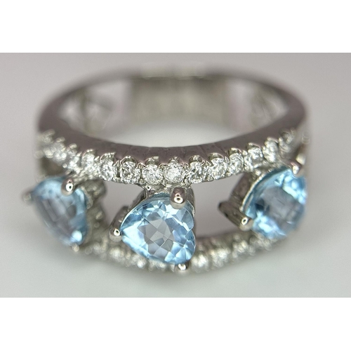 523 - A 18K WHITE GOLD 0.38CT DIAMOND & BLUE TOPAZ RING. TOTAL WEIGHT 5G. SIZE M. REF AS 1077.