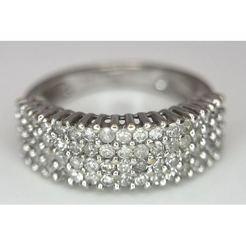 516 - A 9K WHITE GOLD 0.75CT DIAMOND 4 ROW RING. TOTAL WEIGHT 3.1G. SIZE J. REF A/S 1123