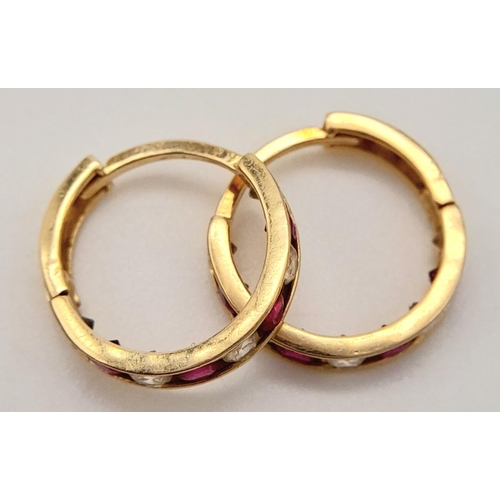 579 - A 14K YELLOW GOLD STONE SET MINI HOOP EARRINGS 1.6G TOTAL WEIGHT, 1CM DIAMETER.

ref: SC 6049