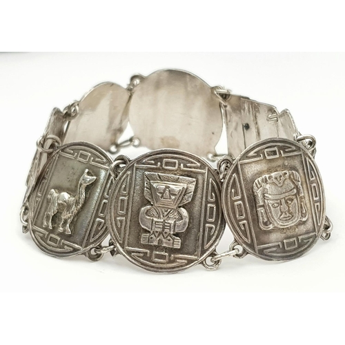 628 - SILVER AZTEC DESIGN BRACELET. 26.12G IN WEIGHT.
Ref: 8065.