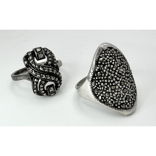 656 - 2 X STERLING SILVER MARQUISITE SET RINGS. 8.7G IN TOTAL WEIGHT. SIZES R & N. (1 stone missing)
Ref: ... 