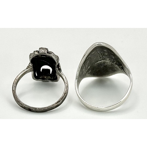 656 - 2 X STERLING SILVER MARQUISITE SET RINGS. 8.7G IN TOTAL WEIGHT. SIZES R & N. (1 stone missing)
Ref: ... 